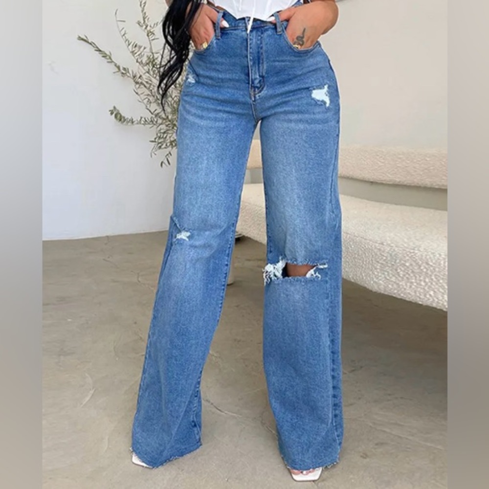 Soft high waist, cut off wide leg blue jeans with rips